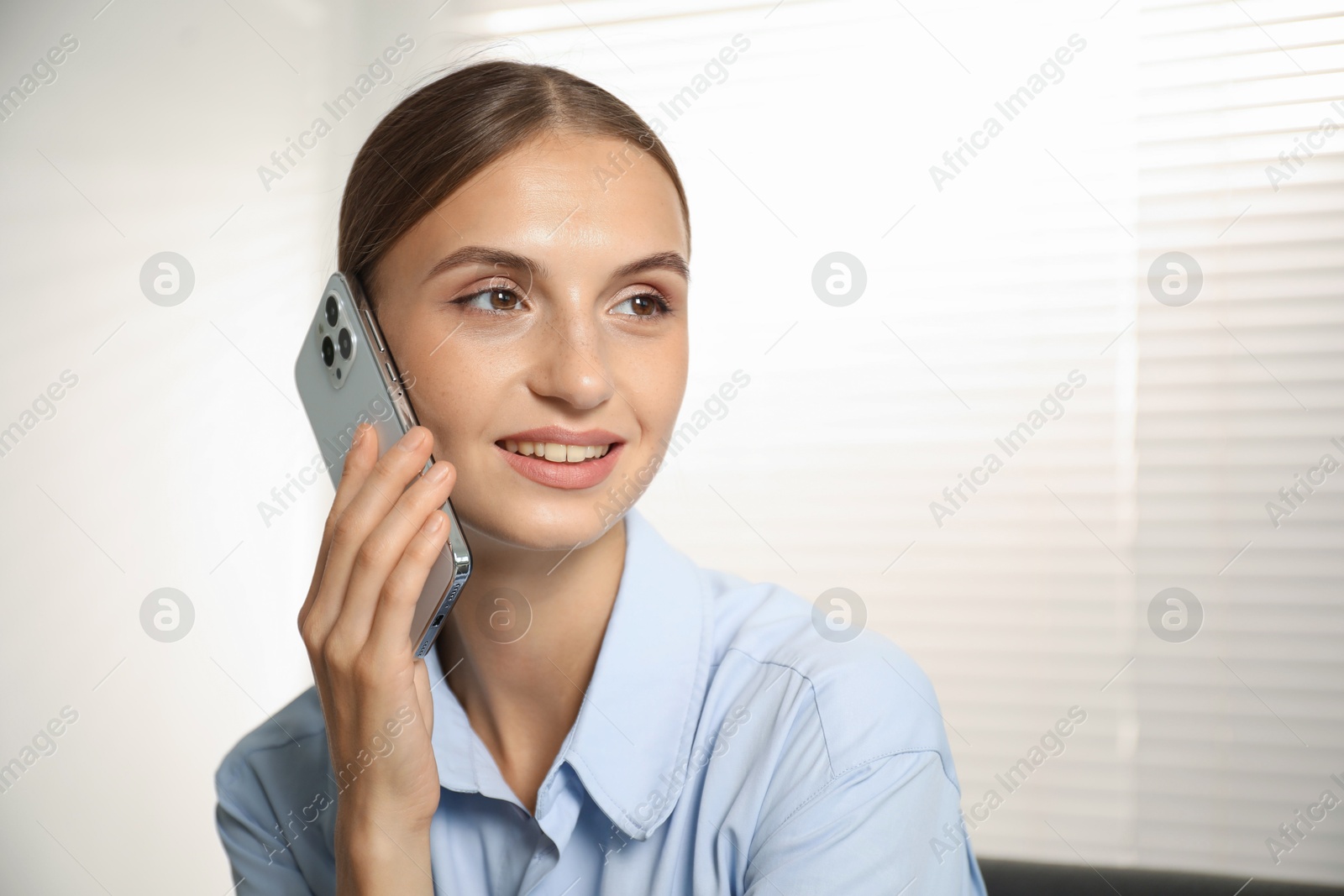 Photo of Beautiful businesswoman talking on phone at home. Space for text