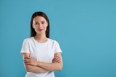 Photo of Portrait of beautiful woman on blue background. Space for text