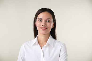 Photo of Portrait of confident businesswoman on white background