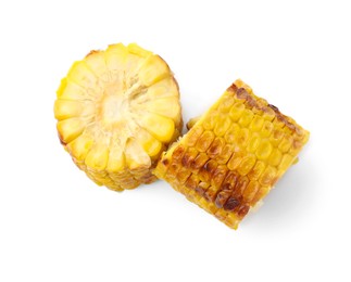 Photo of Pieces of tasty grilled corncobs isolated on white, top view
