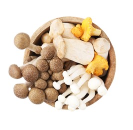 Photo of Different raw mushrooms in bowl isolated on white, top view