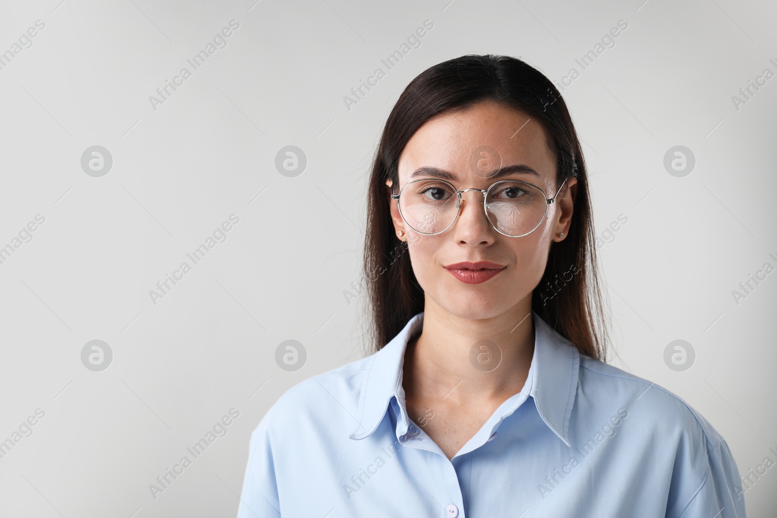 Photo of Portrait of confident businesswoman on white background. Space for text