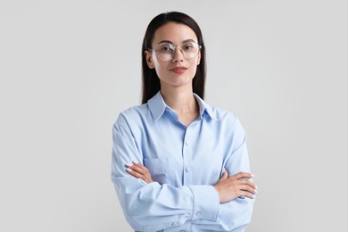 Photo of Portrait of confident businesswoman on white background