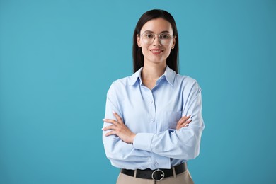 Photo of Portrait of confident businesswoman on blue background. Space for text