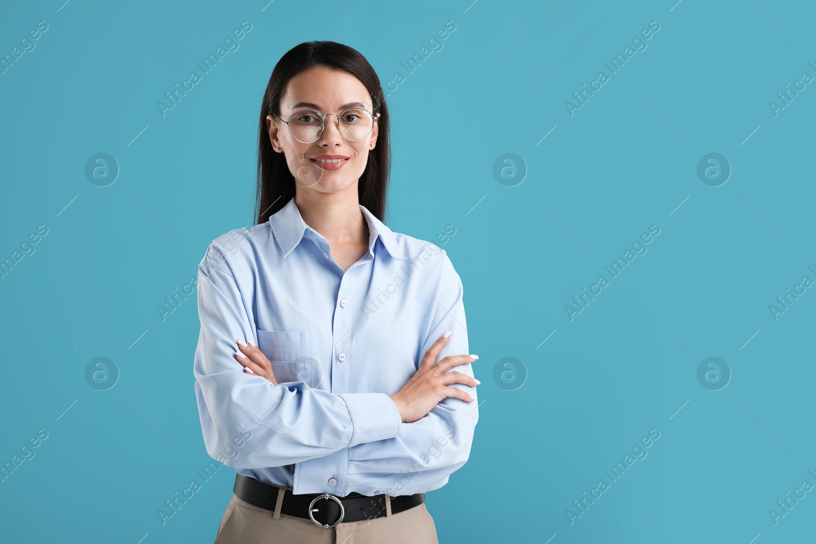Photo of Portrait of confident businesswoman on blue background. Space for text