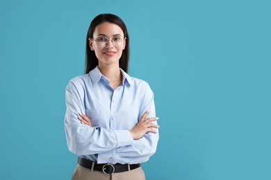 Photo of Portrait of confident businesswoman on blue background. Space for text