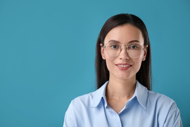 Photo of Portrait of confident businesswoman on blue background. Space for text