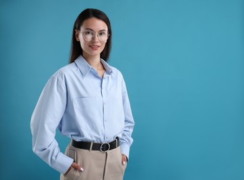 Photo of Portrait of confident businesswoman on blue background. Space for text