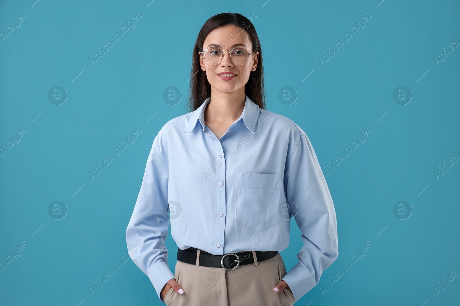 Photo of Portrait of confident businesswoman on blue background