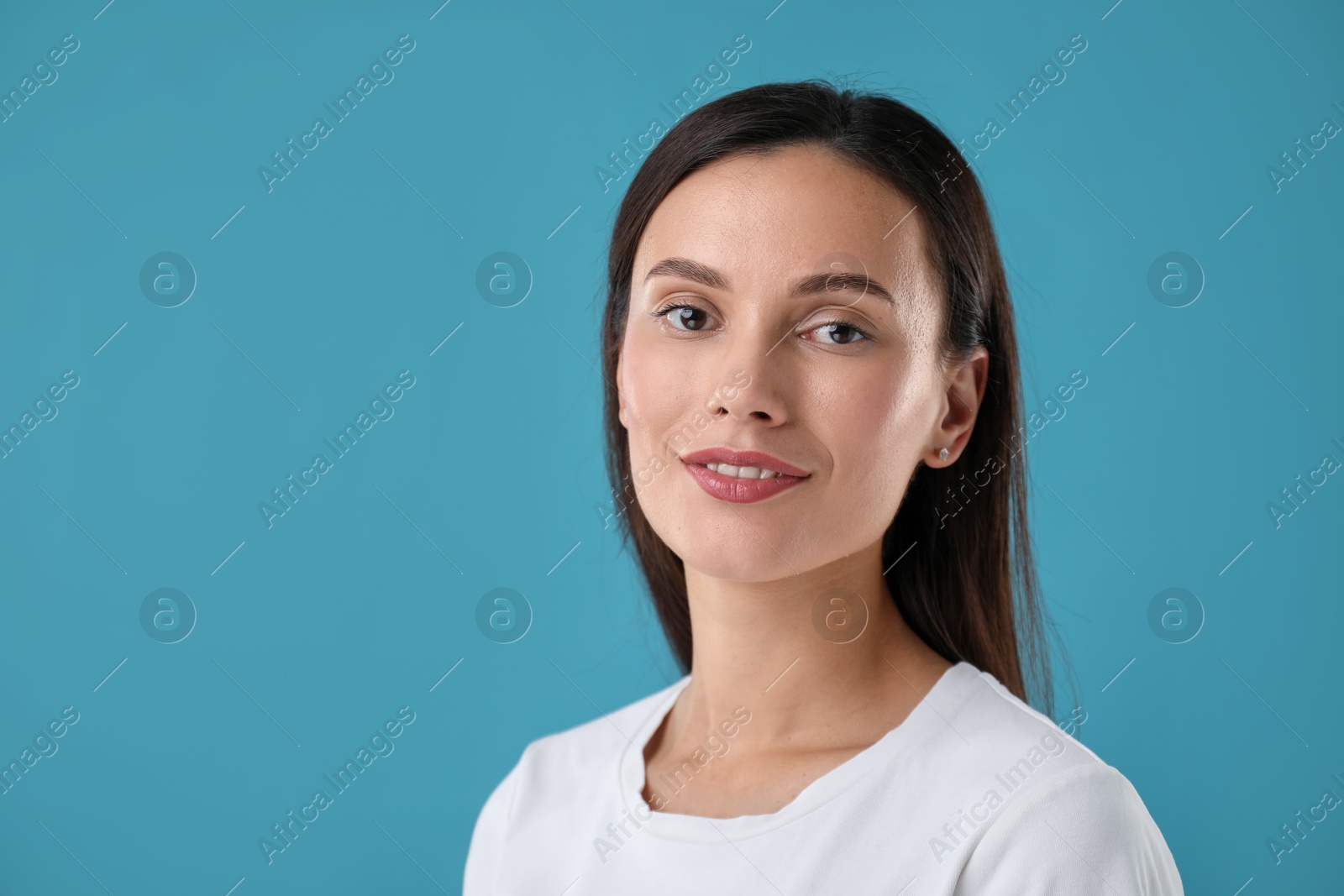 Photo of Portrait of beautiful woman on blue background. Space for text