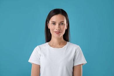 Photo of Portrait of beautiful woman on blue background
