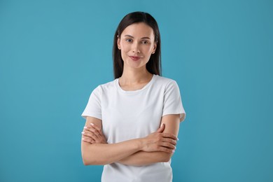 Photo of Portrait of beautiful woman on blue background