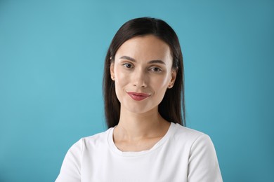 Photo of Portrait of beautiful woman on blue background