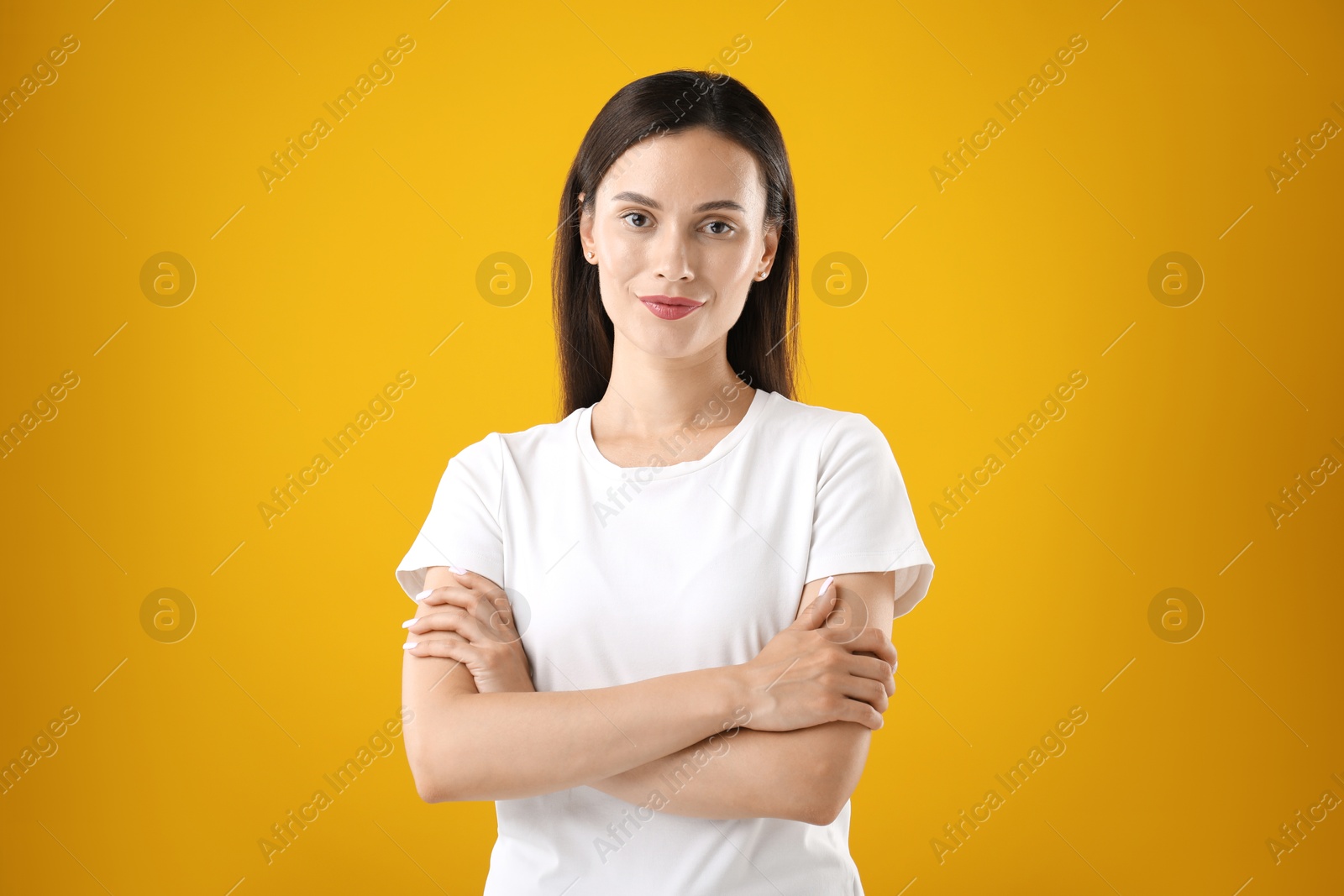 Photo of Portrait of beautiful woman on yellow background
