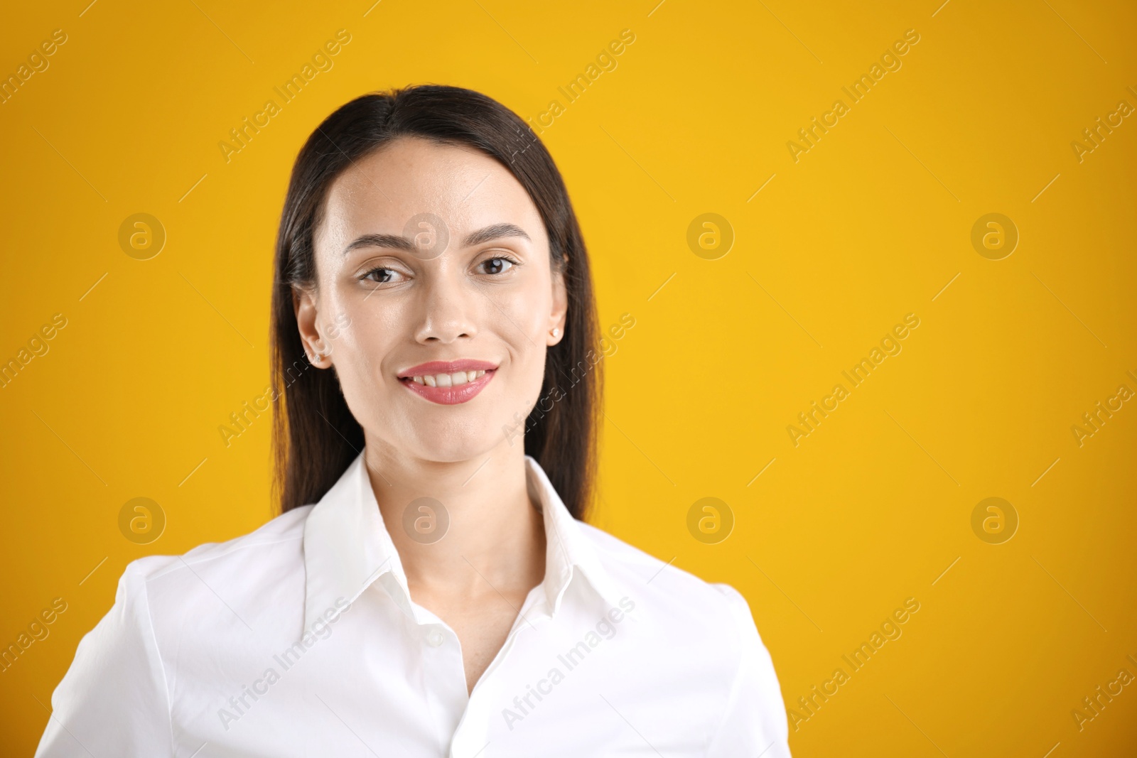 Portrait of confident businesswoman on yellow background. Space for text Photo of Portrait of confident businesswoman on yellow background. Space for text