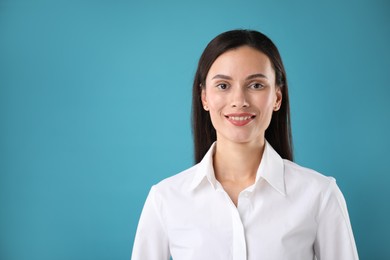 Photo of Portrait of confident businesswoman on blue background. Space for text