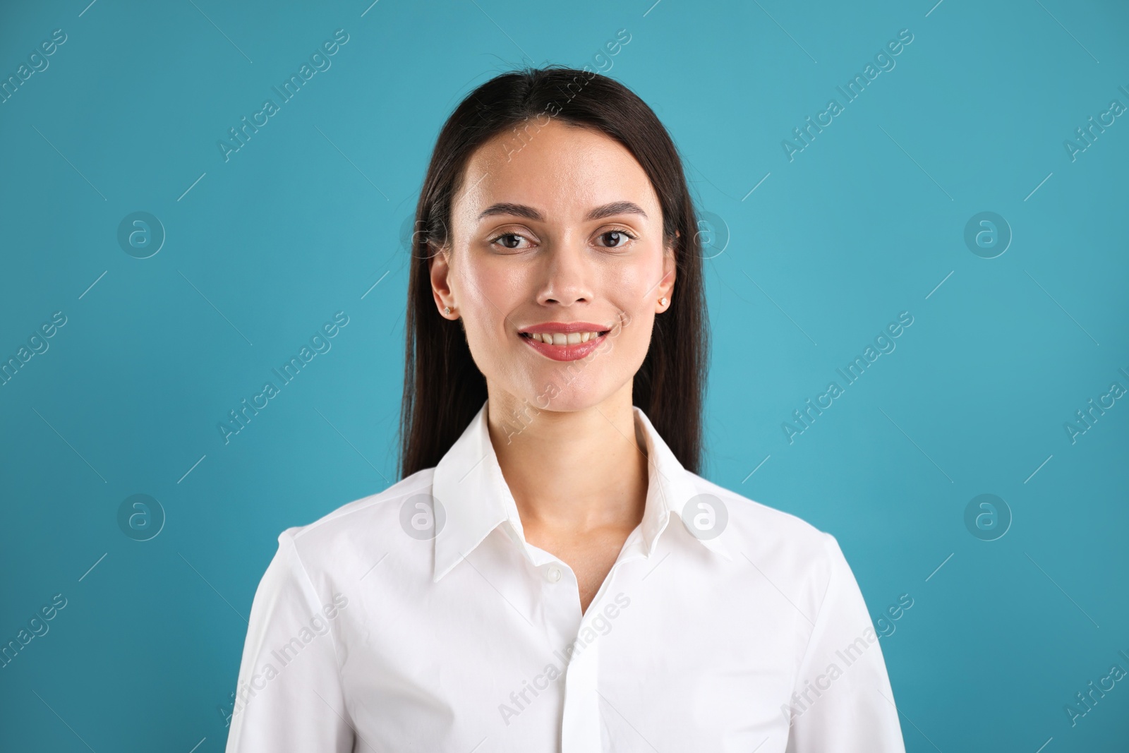 Photo of Portrait of confident businesswoman on blue background