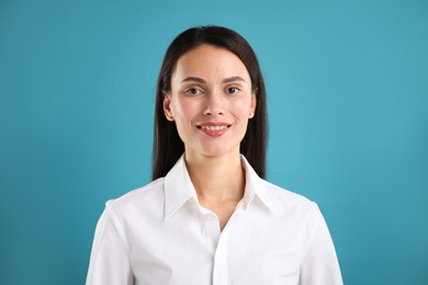 Photo of Portrait of confident businesswoman on blue background
