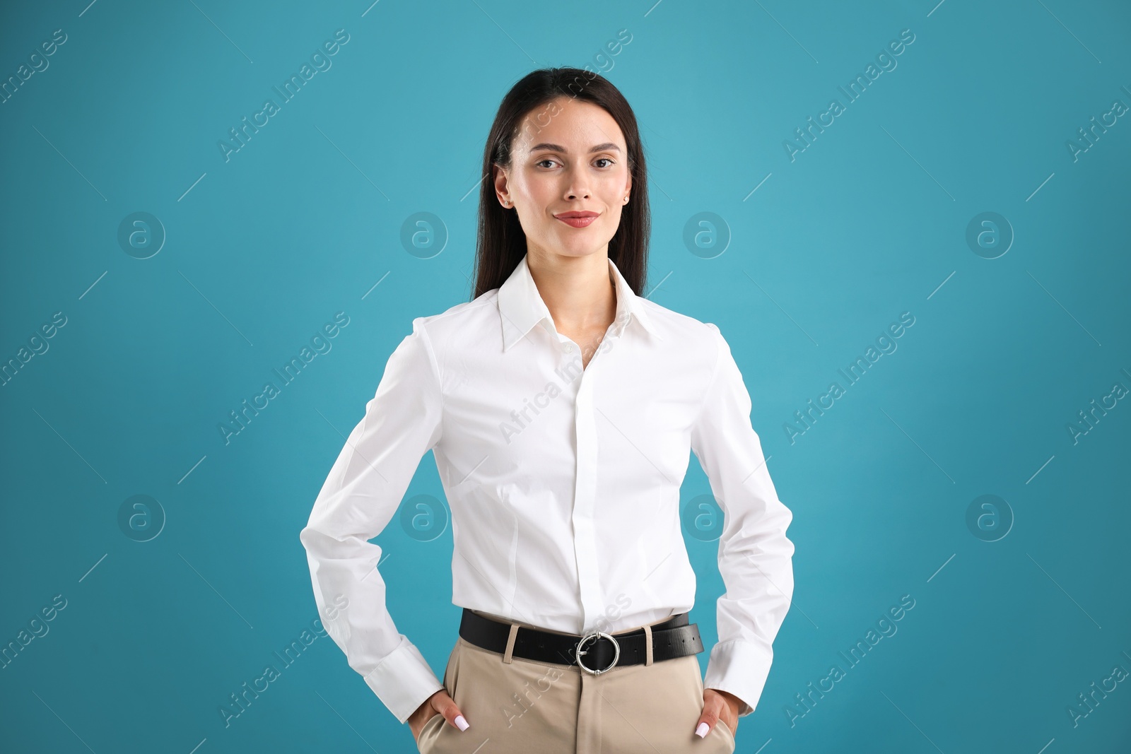 Photo of Portrait of confident businesswoman on blue background
