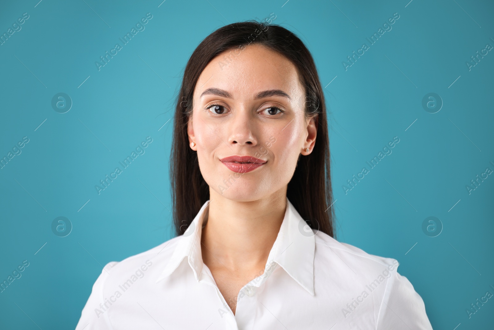 Photo of Portrait of confident businesswoman on blue background
