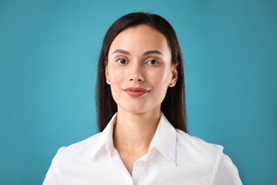 Photo of Portrait of confident businesswoman on blue background