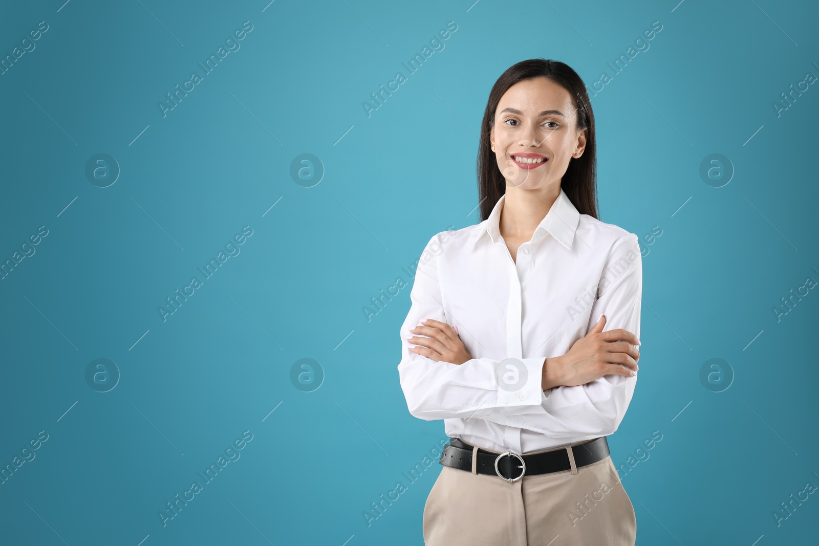 Photo of Portrait of confident businesswoman on blue background. Space for text