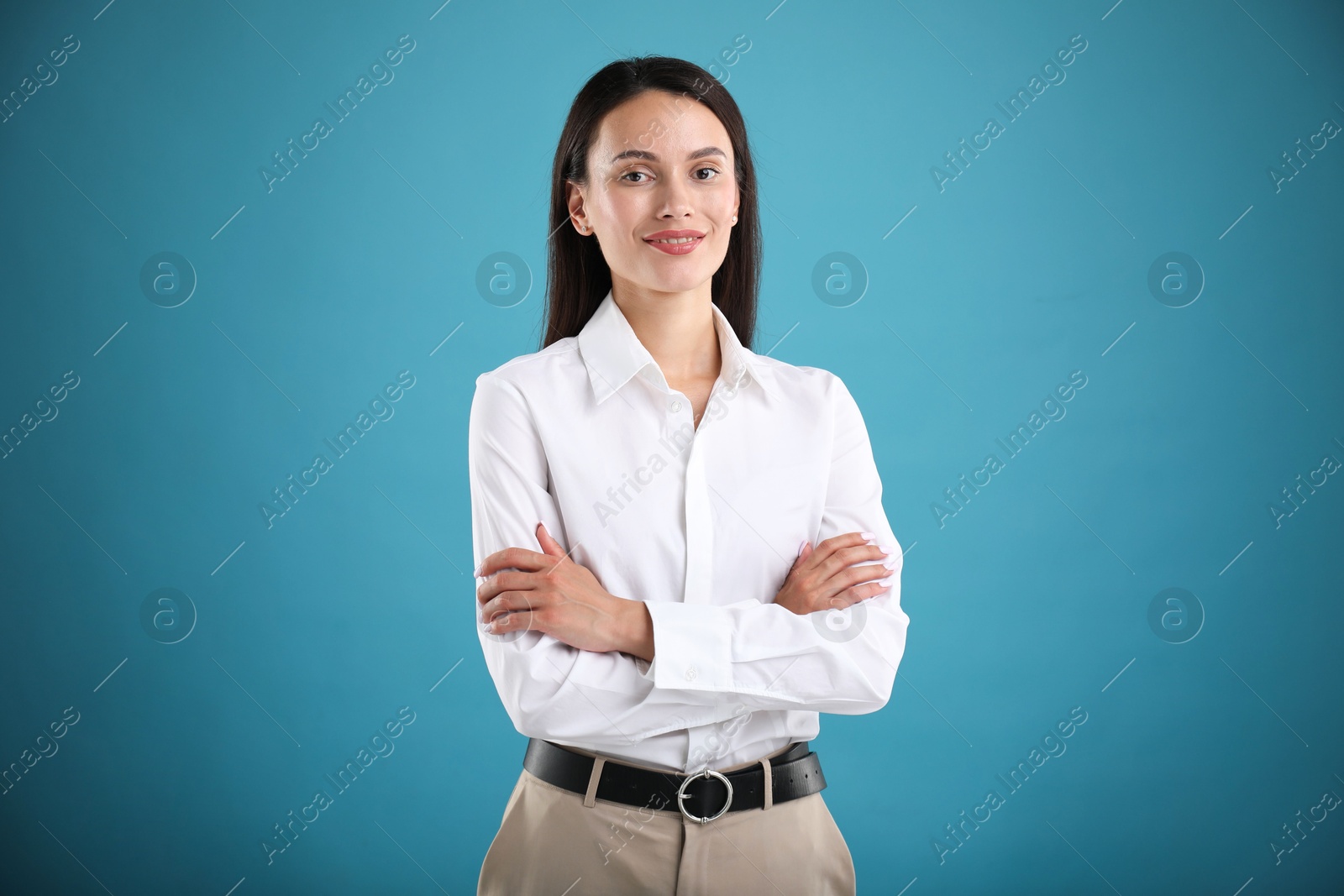 Photo of Portrait of confident businesswoman on blue background