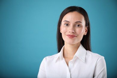 Photo of Portrait of confident businesswoman on blue background. Space for text