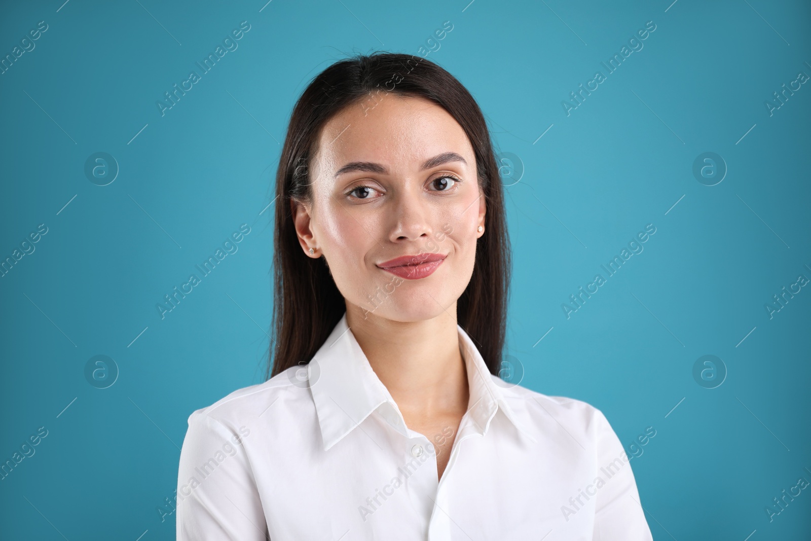 Photo of Portrait of confident businesswoman on blue background