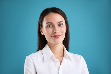 Photo of Portrait of confident businesswoman on blue background
