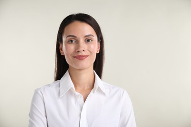 Photo of Portrait of confident businesswoman on white background. Space for text