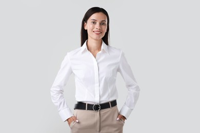 Photo of Portrait of confident businesswoman on white background
