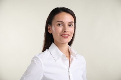 Photo of Portrait of confident businesswoman on white background