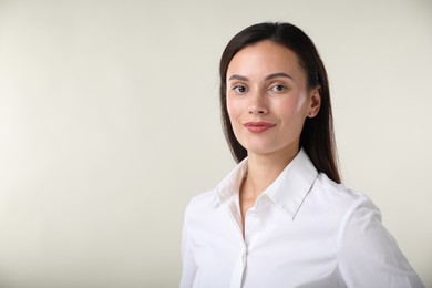 Photo of Portrait of confident businesswoman on white background. Space for text