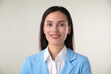 Photo of Portrait of confident businesswoman on white background