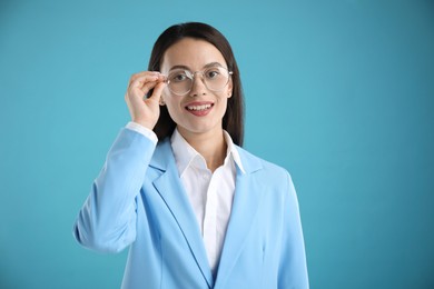 Photo of Portrait of confident businesswoman on light blue background