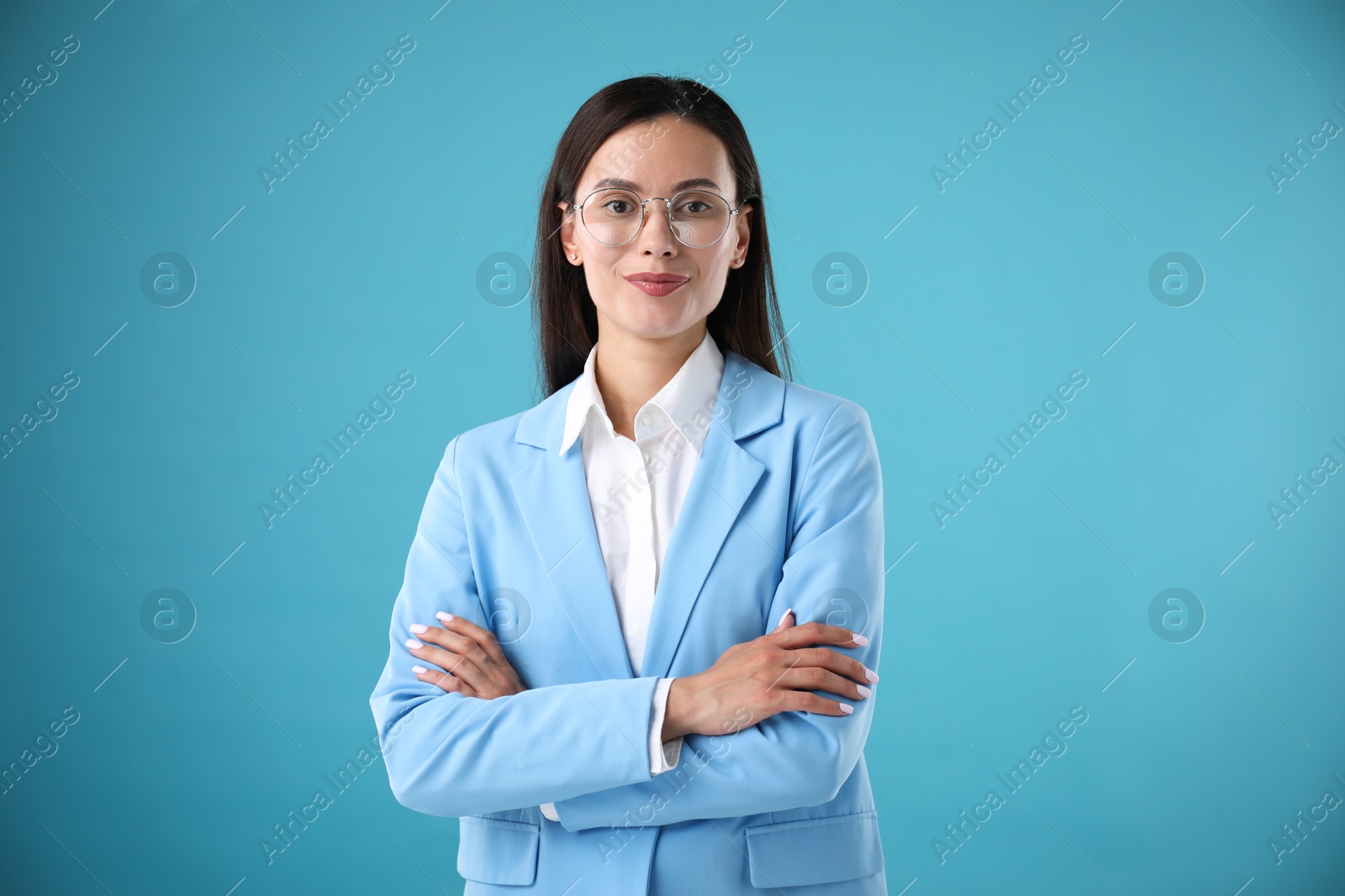 Photo of Portrait of confident businesswoman on light blue background