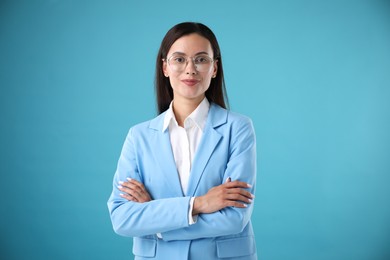 Photo of Portrait of confident businesswoman on light blue background