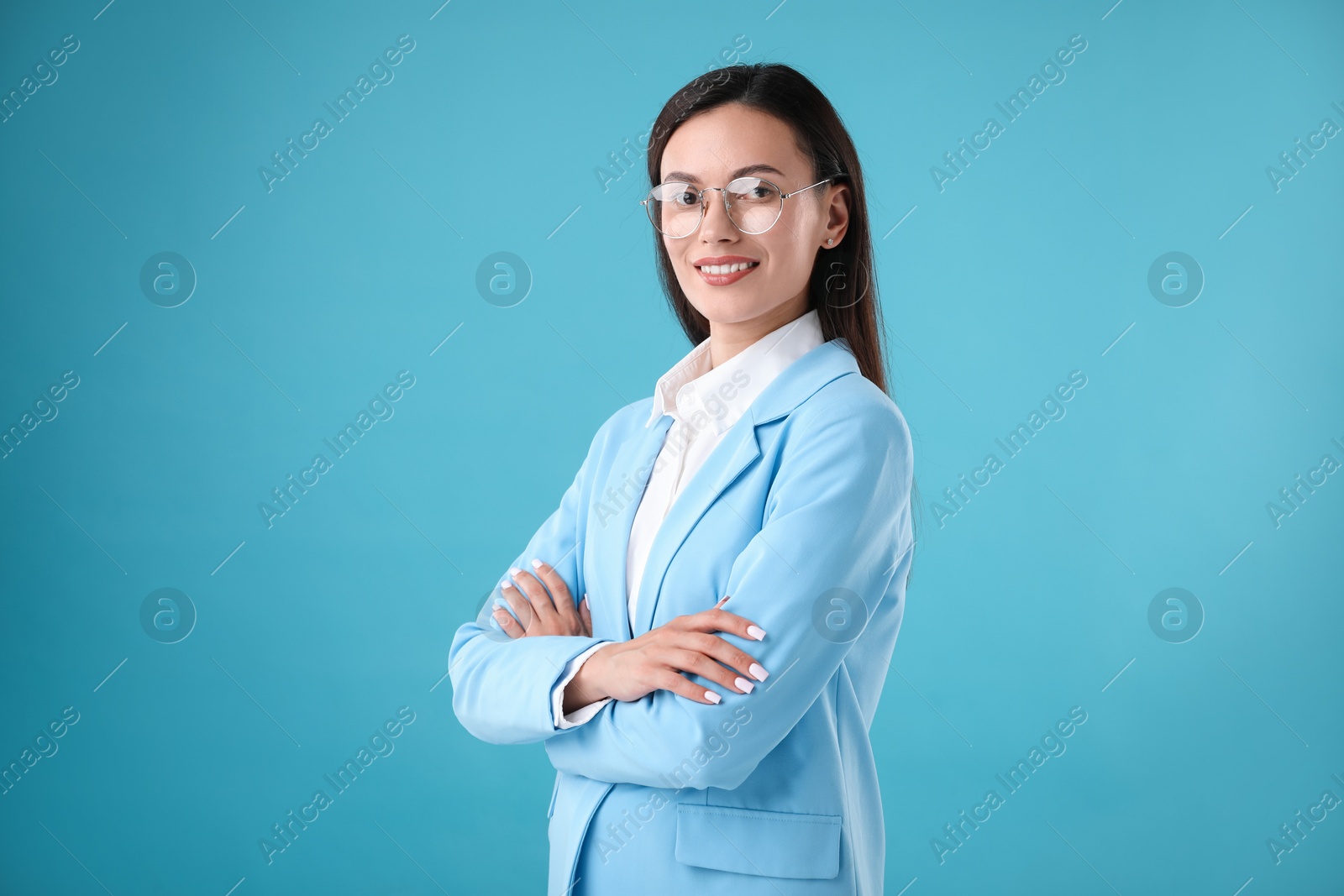 Photo of Portrait of confident businesswoman on light blue background