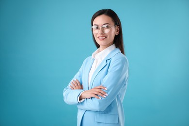 Photo of Portrait of confident businesswoman on light blue background