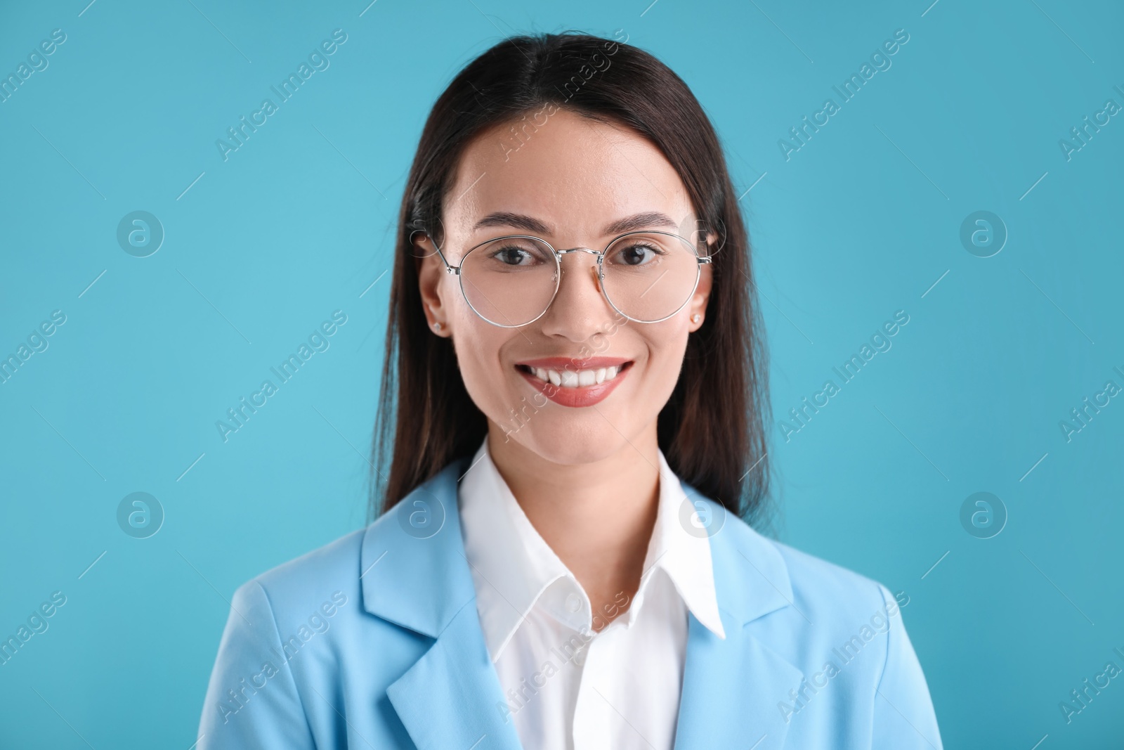 Photo of Portrait of confident businesswoman on light blue background