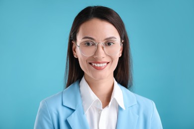 Photo of Portrait of confident businesswoman on light blue background