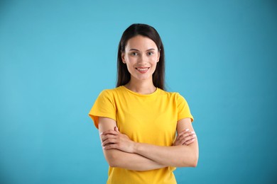 Photo of Portrait of beautiful woman on light blue background