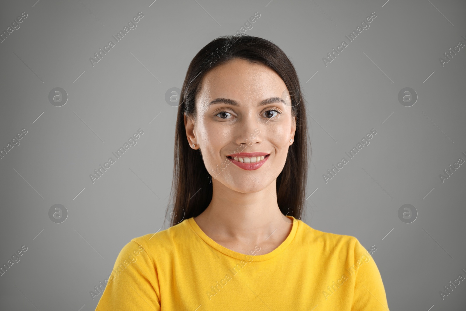 Photo of Portrait of beautiful woman on light grey background