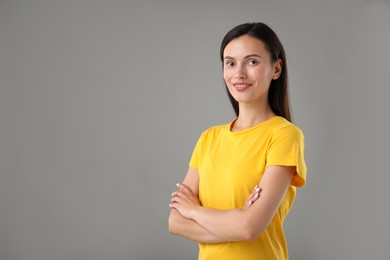 Photo of Portrait of beautiful woman on light grey background. Space for text
