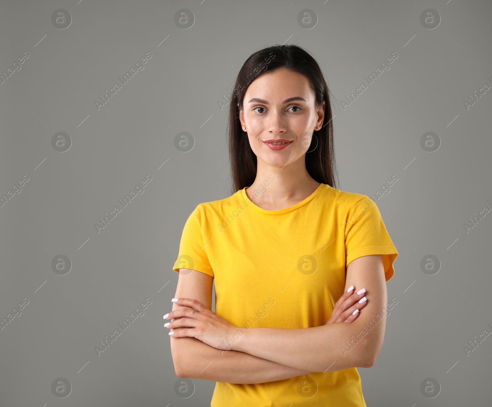 Photo of Portrait of beautiful woman on light grey background