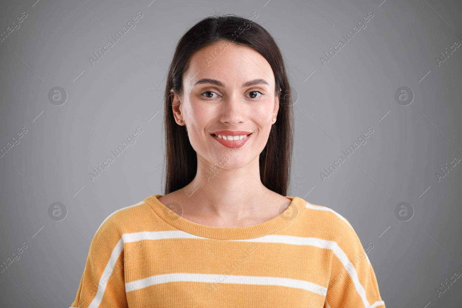 Photo of Portrait of beautiful woman on light grey background