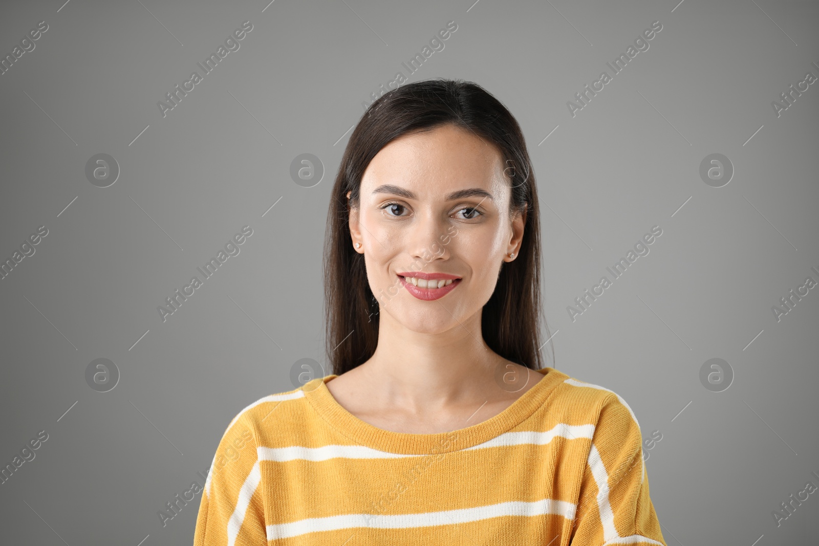 Photo of Portrait of beautiful woman on light grey background