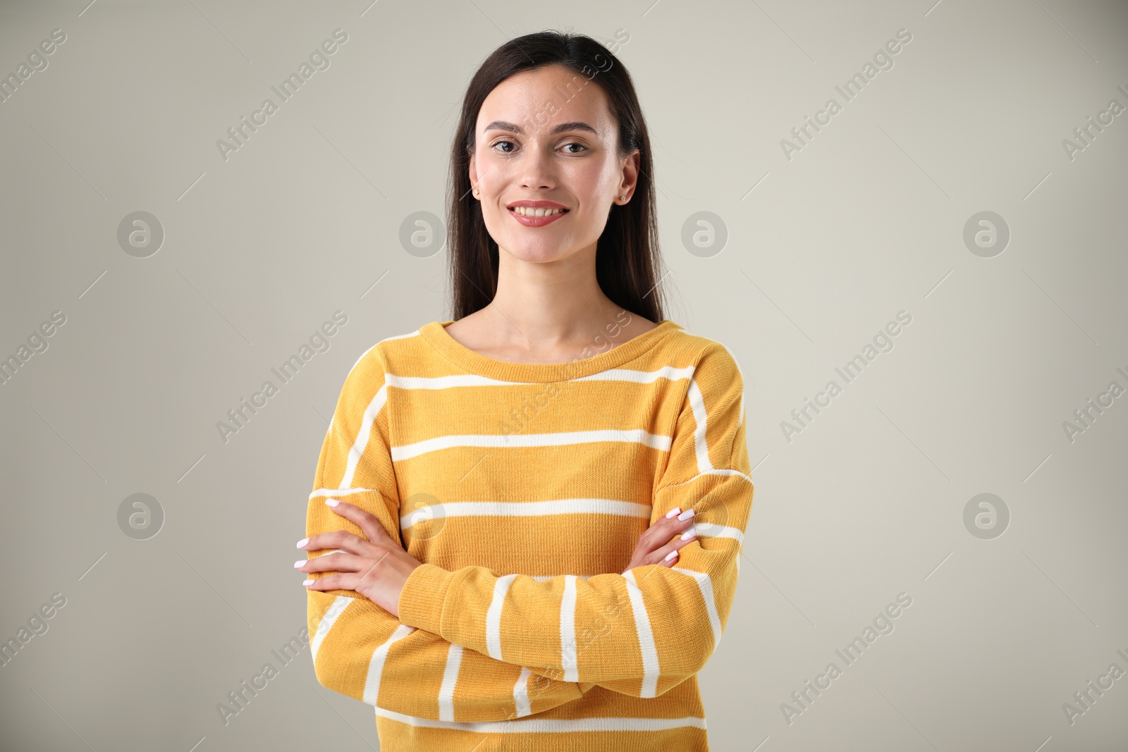 Photo of Portrait of beautiful woman on light background