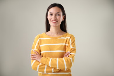 Photo of Portrait of beautiful woman on light background